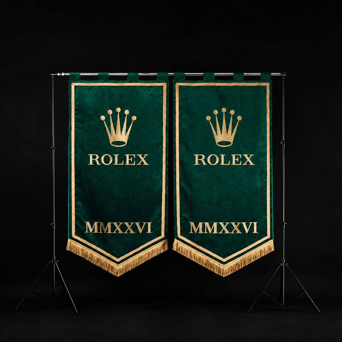 Two matching green Rolex pennant banners with gold embroidery, displayed side-by-side on a black studio background stand.