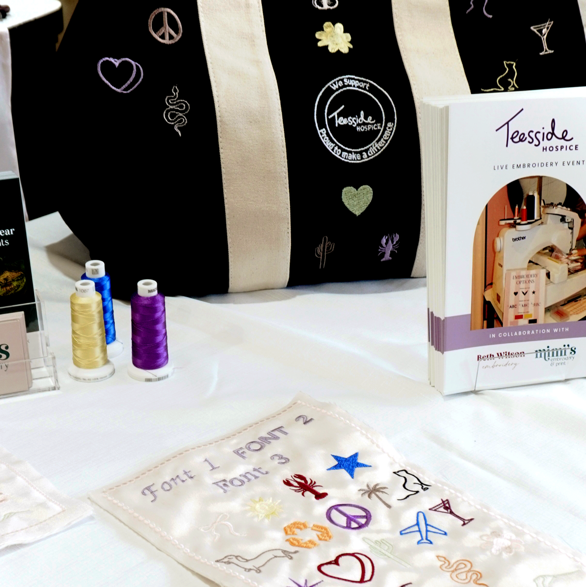 Close-up of bespoke embroidered icon created for a live retail embroidery event.